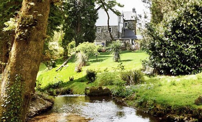 View of house from the victorian pool in spring